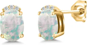 Gem Stone King 18K Yellow Gold Plated Silver White Simulated Opal and White Topaz Stud Earrings For Women (2.07 Cttw, Gemstone October Birthstone, Oval Cabochon 7X5MM)